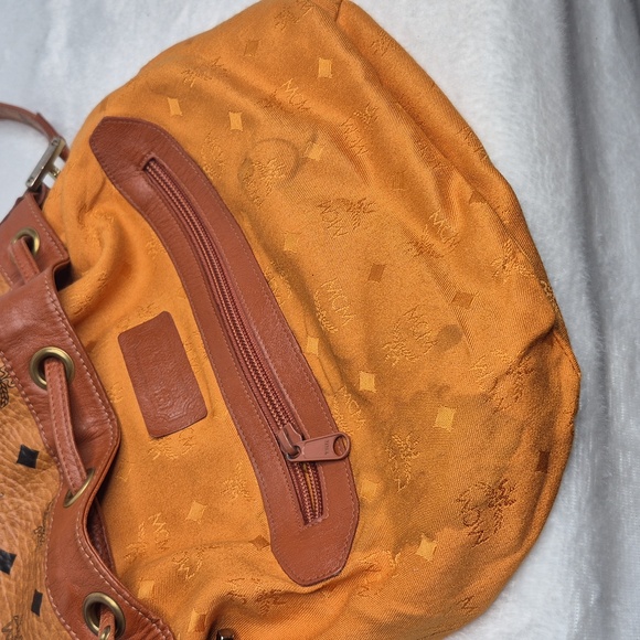 MCM Cognac Leather Drawstring Shoulder Crossbody Bucket Bag with Charm - Picture 13 of 17